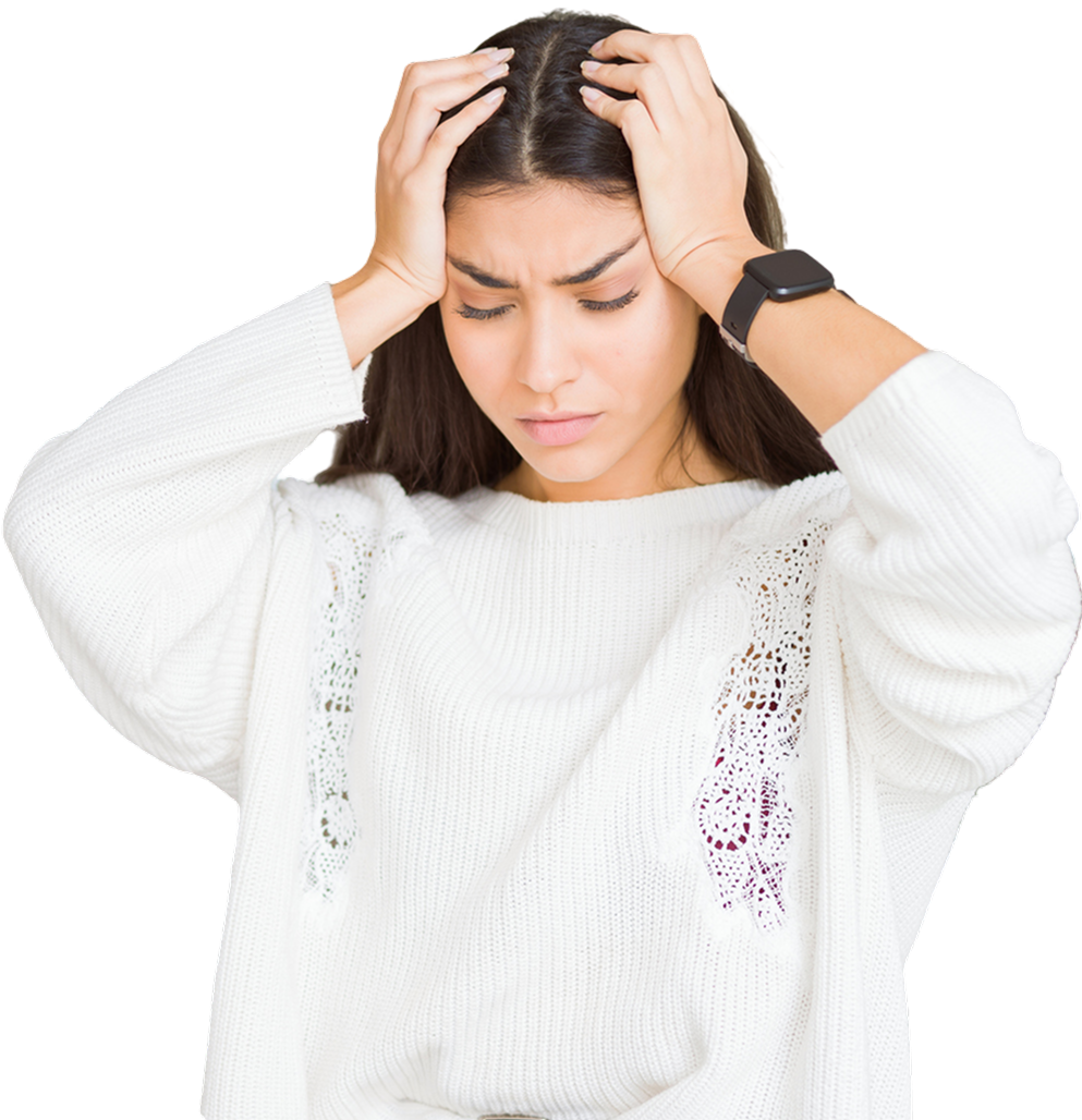 Woman in white sweater looking stressed, holding her head.
